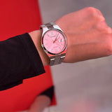 Wrist with a Citizen watch.