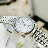 Citizen silver wristwatch with white face.