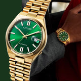 Citizen gold watch with green face