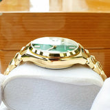 Citizen NJ0152-51X-3 gold watch with green dial