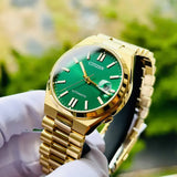 Citizen NJ0152-51X-7 gold watch with green face