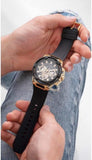 Guess Matrix Men's Watch held in hands