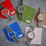 Watches with colorful faces on Pantone swatches